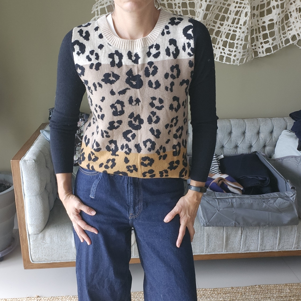 Chic Leopard Print Sweater with Black Sleeves